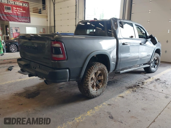 2020 Ram 1500 Rebel with VIN 1C6SRFLT0LN162491, listed as a IAAI auction lot 41841159 with 58,265 mi miles and . Bid and sale history available at DreamBid. Image 4.