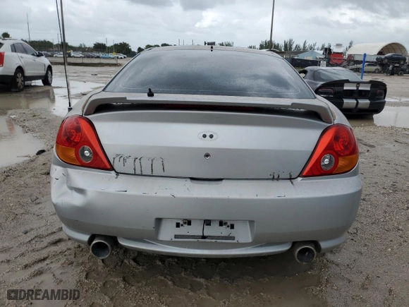 2003 Hyundai Tiburon GT with VIN KMHHN65F23U084299, listed as a Copart auction lot 75105394 with 90,598 mi miles and Clean Title. Bid and sale history available at carsss.com. Image 6.