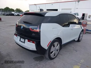 2015 BMW i3 with VIN WBY1Z4C59FV503755, listed as a IAAI auction lot 41303560 with Not provided miles and . Bid and sale history available at DreamBid. Image 4.