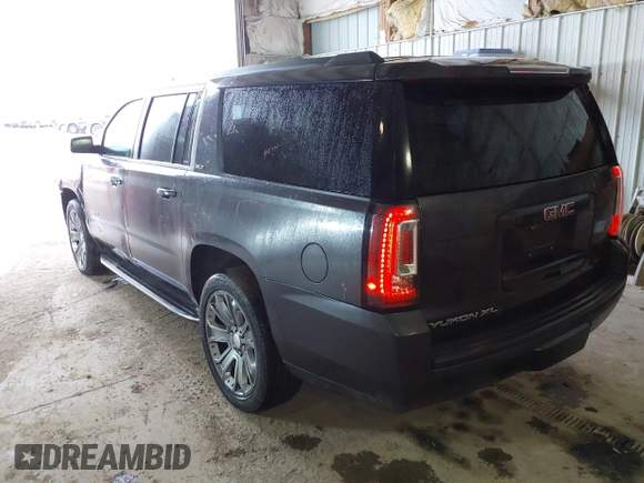 2015 GMC Yukon XL SLT with VIN 1GKS2HKC6FR667110, listed as a IAAI auction lot 41472250 with 141,383 mi miles. Bid and sale history available at carsss.com. Image 3.