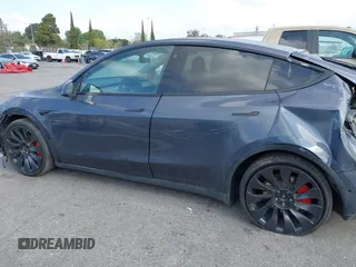 2022 Tesla Model Y Performance with VIN 7SAYGDEF7NF563433, listed as a IAAI auction lot 41713557 with Not Provided miles and . Bid and sale history available at DreamBid. Image 13.