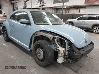 2014 Volkswagen Beetle 1.8T with VIN 3VWJ17ATXEM663919, listed as a IAAI auction lot 42549863 with 67,987 mi miles and . Bid and sale history available at DreamBid. Image 1.
