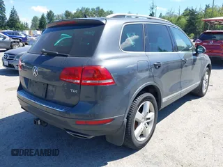 2012 Volkswagen Touareg Sport with VIN WVGFK9BP0CD004951, listed as a IAAI auction lot 42724125 with 173,993 mi miles and . Bid and sale history available at DreamBid. Image 4.
