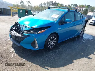2021 Toyota Prius LE with VIN JTDKAMFP7M3180504, listed as a IAAI auction lot 41985409 with 56,617 mi miles and . Bid and sale history available at DreamBid. Image 17.