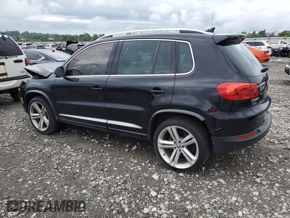 2014 Volkswagen Tiguan SEL with VIN WVGAV3AX7EW101796, listed as a Copart auction lot 60904345 with 97,652 mi miles and Salvage title. Bid and sale history available at DreamBid. Image 2.