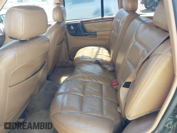 1996 Jeep Grand Cherokee Limited z VIN 1J4GZ78Y3TC191000, wystawiony jako IAAI lot #42259621 z przebiegiem 212 690 mil mil oraz . Historia ofert i sprzedaży dostępna na DreamBid. Obrazek 8.