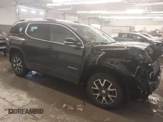 2021 GMC Acadia SLE with VIN 1GKKNRLS9MZ232758, listed as a IAAI auction lot 41548170 with 56,714 mi miles. Bid and sale history available at carsss.com. Image 1.