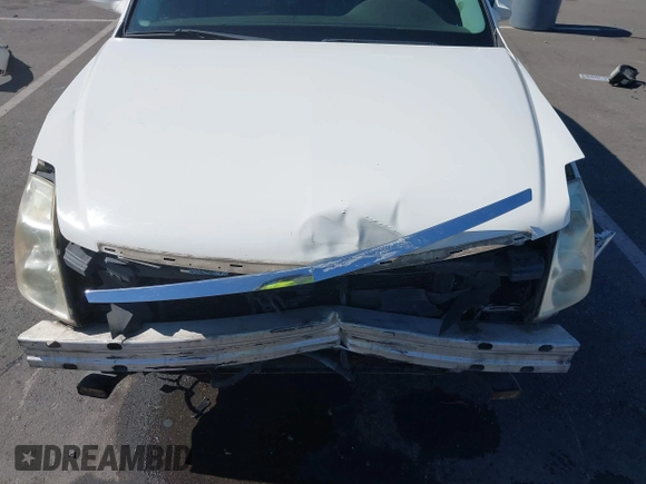 2007 Cadillac DTS Luxury I z VIN 1G6KD57Y77U133267, wystawiony jako IAAI lot #42337188 z przebiegiem 126 063 mil mil oraz . Historia ofert i sprzedaży dostępna na DreamBid. Obrazek 6.