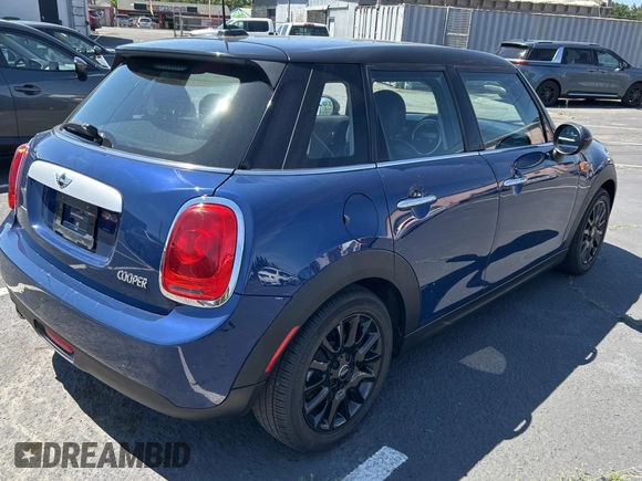 2015 MINI Hardtop 4 Door with VIN WMWXS5C5XFT831166, listed as a Copart auction lot 56714285 with 69,668 mi miles and Salvage Title. Bid and sale history available at DreamBid. Image 4.