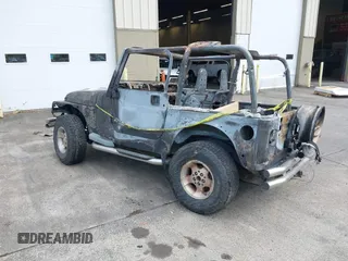 2000 Jeep Wrangler Sport with VIN 1J4FA49S5YP797345, listed as a IAAI auction lot 40322775 with Not Provided miles and . Bid and sale history available at DreamBid. Image 3.