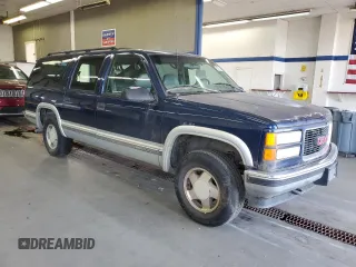 1999 GMC Suburban z VIN 3GKFK16R5XG525338, wystawiony jako Copart lot #58920565 z przebiegiem 212 586 mil mil oraz Szkody całkowita. Historia ofert i sprzedaży dostępna na DreamBid. Obrazek 4.