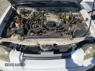 2002 Nissan Frontier SE z VIN 1N6ED27T42C319065, wystawiony jako Copart lot #74206474 z przebiegiem 147 724 mil mil oraz Szkoda całkowita • Salvage title. Historia ofert i sprzedaży dostępna na DreamBid. Obrazek 11.