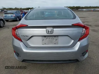 2017 Honda Civic LX z VIN 2HGFC2F52HH551152, wystawiony jako Copart lot #52728275 z przebiegiem 64 376 mil mil oraz Szkoda całkowita • Salvage title. Historia ofert i sprzedaży dostępna na DreamBid. Obrazek 6.