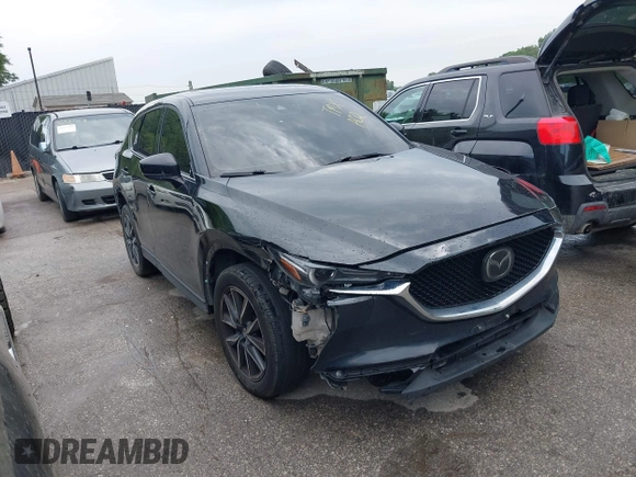 2018 Mazda CX-5 Grand Touring with VIN JM3KFBDM2J0400828, listed as a IAAI auction lot 42540846 with 254,672 mi miles and . Bid and sale history available at DreamBid. Image 1.