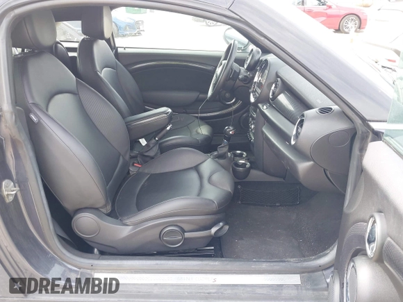 2013 MINI Coupe S with VIN WMWSX3C50DT466882, listed as a IAAI auction lot 42026938 with 99,499 mi miles and . Bid and sale history available at DreamBid. Image 5.