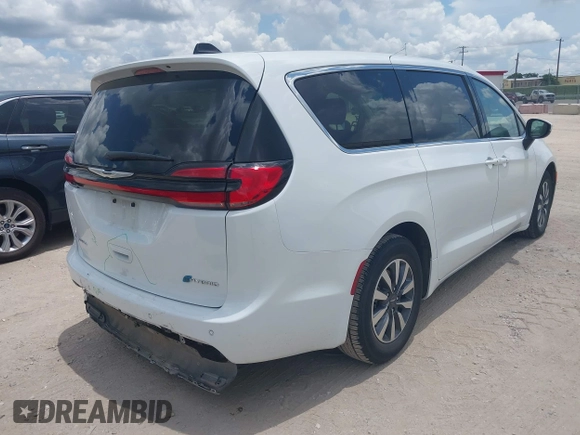 2023 Chrysler Pacifica Hybrid Touring L with VIN 2C4RC1L71PR622474, listed as a IAAI auction lot 42595061 with 55,880 mi miles and . Bid and sale history available at DreamBid. Image 4.