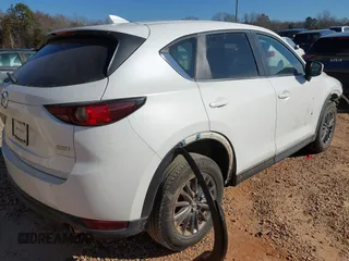 2019 Mazda CX-5 Sport with VIN JM3KFBBM0K0574255, listed as a IAAI auction lot 41661924 with 93,851 mi miles and . Bid and sale history available at DreamBid. Image 4.