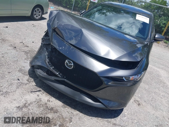 2022 Mazda 3 Select z VIN JM1BPAKL1N1519383, wystawiony jako IAAI lot #39742243 z przebiegiem 20 080 mil mil oraz . Historia ofert i sprzedaży dostępna na DreamBid. Obrazek 6.