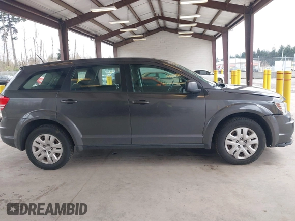 2015 Dodge Journey SE z VIN 3C4PDCAB1FT617794, wystawiony jako IAAI lot #41922371 z przebiegiem 130 558 mil mil oraz . Historia ofert i sprzedaży dostępna na DreamBid. Obrazek 14.