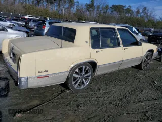 1990 Cadillac DeVille z VIN 1G6CD5333L4256377, wystawiony jako Copart lot #42613635 z przebiegiem 136 754 mil mil oraz Szkoda całkowita • Salvage title. Historia ofert i sprzedaży dostępna na DreamBid. Obrazek 3.
