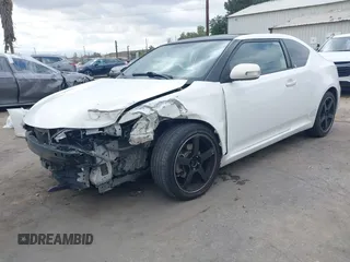 2014 Scion tC with VIN JTKJF5C79E3075707, listed as a IAAI auction lot 41557310 with 132,468 mi miles. Bid and sale history available at carsss.com. Image 18.