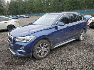 2018 BMW X1 xDrive28i with VIN WBXHT3C37J5F89432, listed as a Copart auction lot 49677075 with 141,684 mi miles and Salvage Title. Bid and sale history available at carsss.com. Image 1.