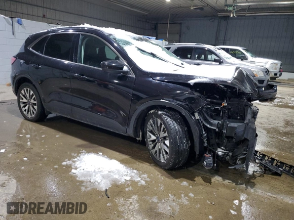 2021 Ford Escape Titanium with VIN 1FMCU9J91MUA57451, listed as a Copart auction lot 44678135 with 74,795 mi miles and Salvage title. Bid and sale history available at DreamBid. Image 4.