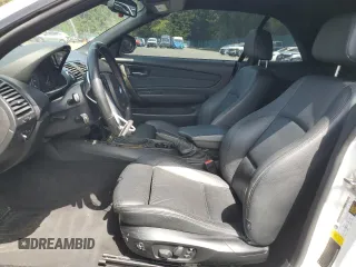 2010 BMW 1 Series 128i with VIN WBAUN1C50AVH81851, listed as a Copart auction lot 56607275 with 145,036 mi miles and Salvage title. Bid and sale history available at DreamBid. Image 7.