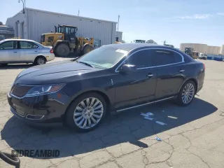 2014 Lincoln MKS z VIN 1LNHL9DK5EG612490, wystawiony jako Copart lot #51872785 z przebiegiem 67 976 mil mil oraz Szkoda całkowita • Salvage title. Historia ofert i sprzedaży dostępna na DreamBid. Obrazek 1.