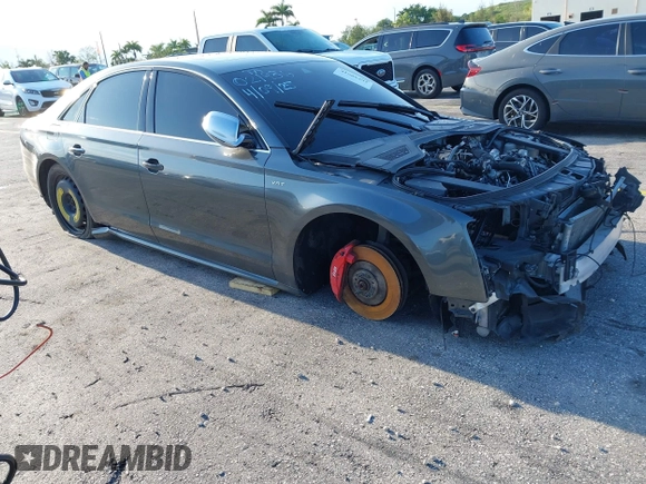 2015 Audi S8 z VIN WAUK2AFD5FN021986, wystawiony jako IAAI lot #41986491 z przebiegiem 142 073 mil mil oraz . Historia ofert i sprzedaży dostępna na DreamBid. Obrazek 1.