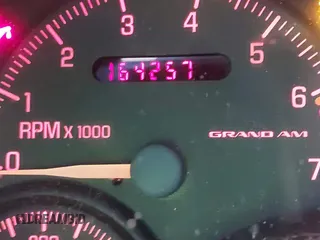1999 Pontiac Grand Am GT1 with VIN 1G2NW52E2XM800431, listed as a IAAI auction lot 41620806 with 164,257 mi miles. Bid and sale history available at carsss.com. Image 7.