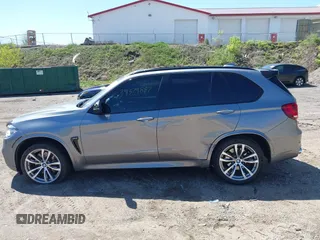 2014 BMW X5 xDrive50i with VIN 5UXKR6C57E0J72301, listed as a IAAI auction lot 39379887 with 117,012 mi miles. Bid and sale history available at carsss.com. Image 14.