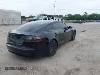 2022 Tesla Model S with VIN 5YJSA1E51NF472152, listed as a IAAI auction lot 42625943 with 60,290 mi miles and . Bid and sale history available at DreamBid. Image 4.