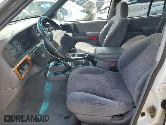 1998 Jeep Grand Cherokee Laredo with VIN 1J4GZ58S4WC244954, listed as a Copart auction lot 55731465 with 205,766 mi miles and Salvage title. Bid and sale history available at DreamBid. Image 7.