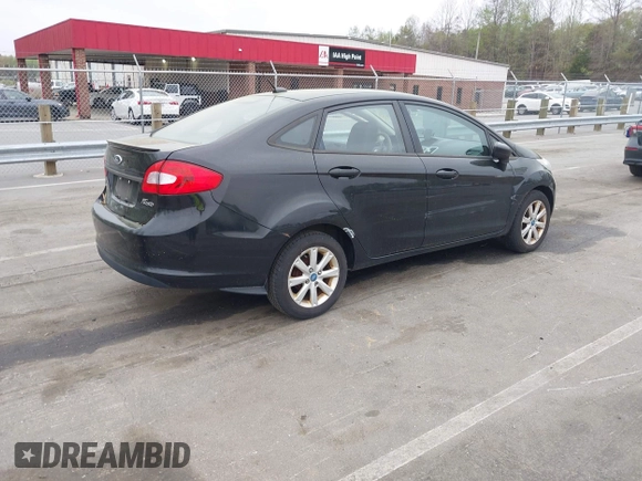 2011 Ford Fiesta SE with VIN 3FADP4BJ5BM221349, listed as a IAAI auction lot 41948737 with 216,540 mi miles. Bid and sale history available at carsss.com. Image 4.