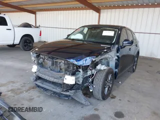 2020 Mazda CX-5 Touring z VIN JM3KFACM2L0802461, wystawiony jako IAAI lot #42148039 z przebiegiem 57 963 mil mil oraz . Historia ofert i sprzedaży dostępna na DreamBid. Obrazek 6.