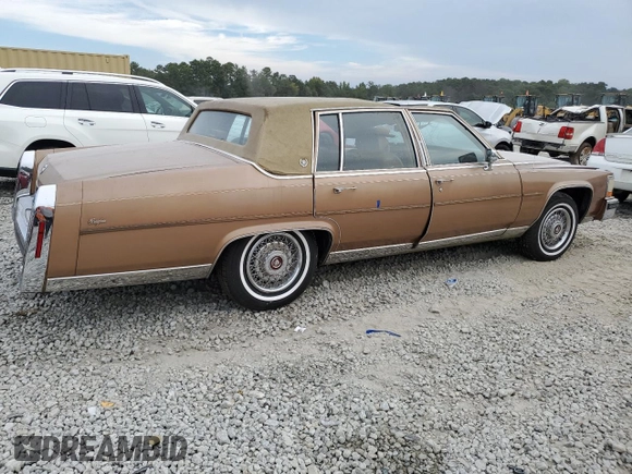 1988 Cadillac Brougham z VIN 1G6DW51Y5J9727006, wystawiony jako Copart lot #70573614 z przebiegiem 34 628 mil mil oraz Szkody całkowita. Historia ofert i sprzedaży dostępna na DreamBid. Obrazek 3.