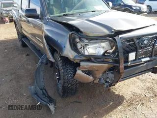 2014 Toyota Tacoma with VIN 3TMLU4EN3EM143882, listed as a IAAI auction lot 40657975 with 125,008 mi miles. Bid and sale history available at carsss.com. Image 6.