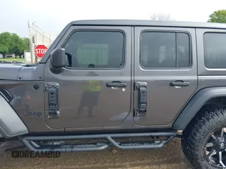 2021 Jeep Wrangler Unlimited Sport S with VIN 1C4HJXDG2MW700461, listed as a IAAI auction lot 41894307 with 82,454 mi miles. Bid and sale history available at carsss.com. Image 14.