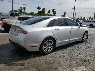 2014 Lincoln MKZ z VIN 3LN6L2G91ER831043, wystawiony jako Copart lot #63109715 z przebiegiem Nie podano mil oraz Szkoda całkowita • Salvage title. Historia ofert i sprzedaży dostępna na DreamBid. Obrazek 3.