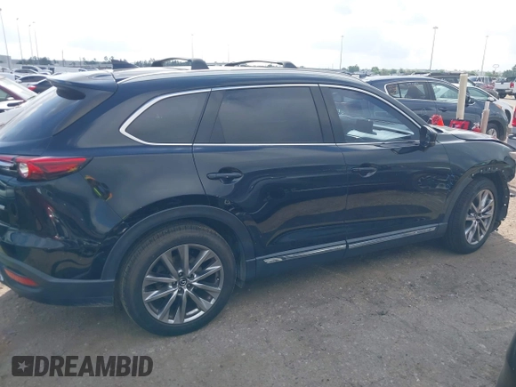 2017 Mazda CX-9 Grand Touring with VIN JM3TCADY5H0129798, listed as a IAAI auction lot 42079754 with 128,403 mi miles and . Bid and sale history available at DreamBid. Image 14.