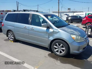 2007 Honda Odyssey Touring with VIN 5FNRL38847B091392, listed as a IAAI auction lot 41956712 with 166,533 mi miles. Bid and sale history available at carsss.com. Image 1.