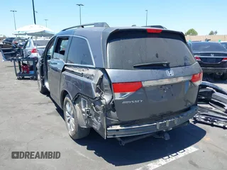 2014 Honda Odyssey EX-L z VIN 5FNRL5H61EB041962, wystawiony jako IAAI lot #42282873 z przebiegiem 134 884 mil mil oraz . Historia ofert i sprzedaży dostępna na DreamBid. Obrazek 3.