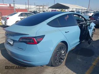 2022 Tesla Model 3 Performance with VIN 5YJ3E1EC1NF144236, listed as a IAAI auction lot 41189644 with Not Provided miles. Bid and sale history available at carsss.com. Image 4.