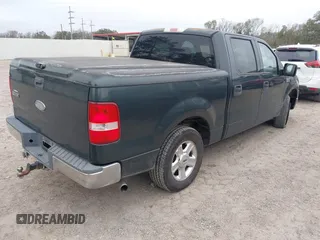 2004 Ford F-150 XLT with VIN 1FTRW12W64KB46944, listed as a IAAI auction lot 41208511 with 293,981 mi miles. Bid and sale history available at carsss.com. Image 4.
