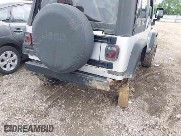 2004 Jeep Wrangler Sport with VIN 1J4FA49S44P772575, listed as a IAAI auction lot 42512876 with 226,387 mi miles and . Bid and sale history available at DreamBid. Image 6.