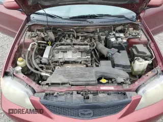 2002 Mazda Protege DX z VIN JM1BJ225320636991, wystawiony jako Copart lot #57915265 z przebiegiem 123 371 mil mil oraz Szkoda całkowita • Salvage title. Historia ofert i sprzedaży dostępna na DreamBid. Obrazek 11.