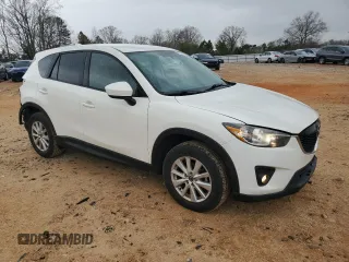 2014 Mazda CX-5 Touring with VIN JM3KE2CY1E0379158, listed as a Copart auction lot 50085935 with 90,340 mi miles and Salvage Title. Bid and sale history available at carsss.com. Image 4.
