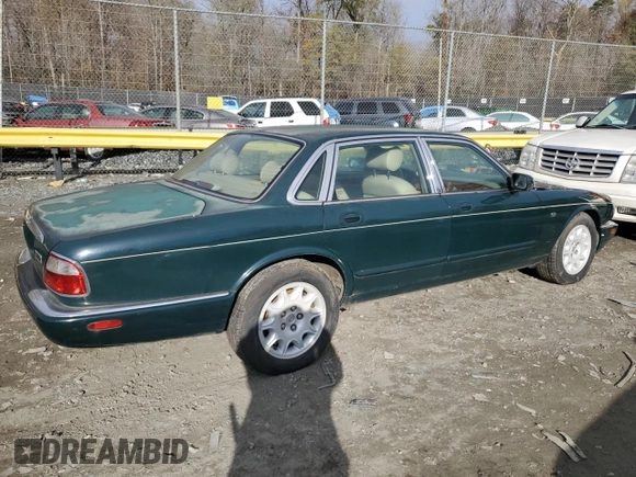 1998 Jaguar XJ with VIN SAJHX1241WC839104, listed as a Copart auction lot 81911744 with 61,956 mi miles and Clean title. Bid and sale history available at DreamBid. Image 3.