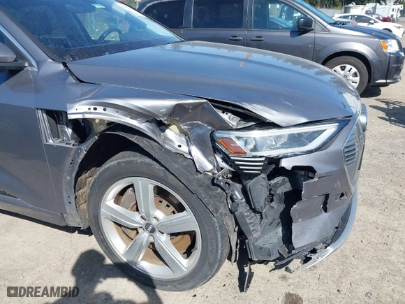 2019 Audi e-tron Premium Plus with VIN WA1LAAGE4KB012574, listed as a IAAI auction lot 41916641 with 104,911 mi miles. Bid and sale history available at carsss.com. Image 6.